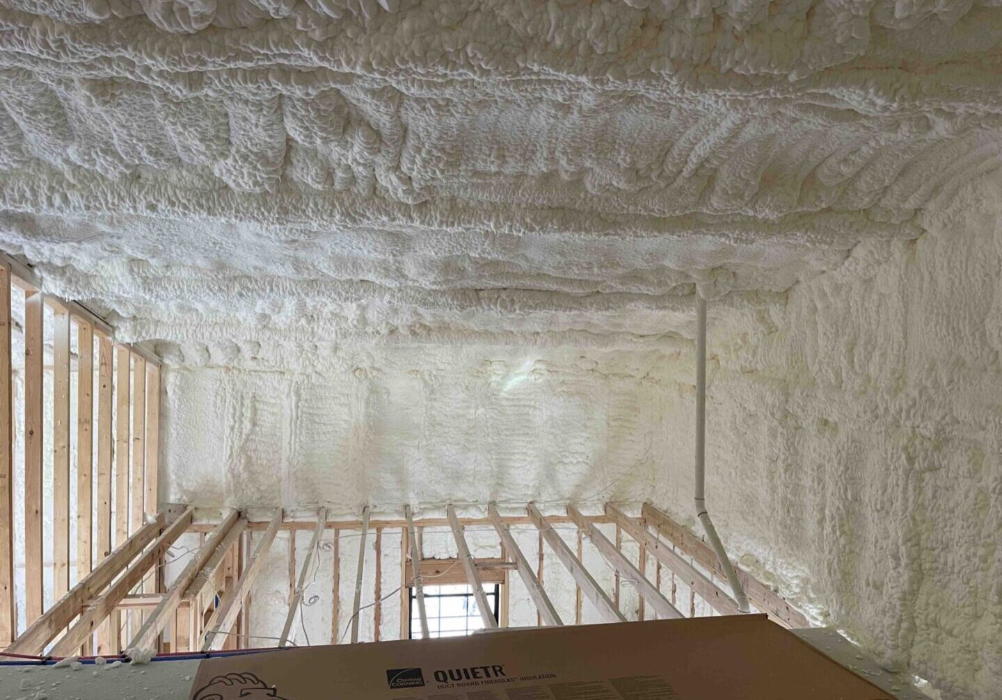 A room with many white foam on the ceiling.